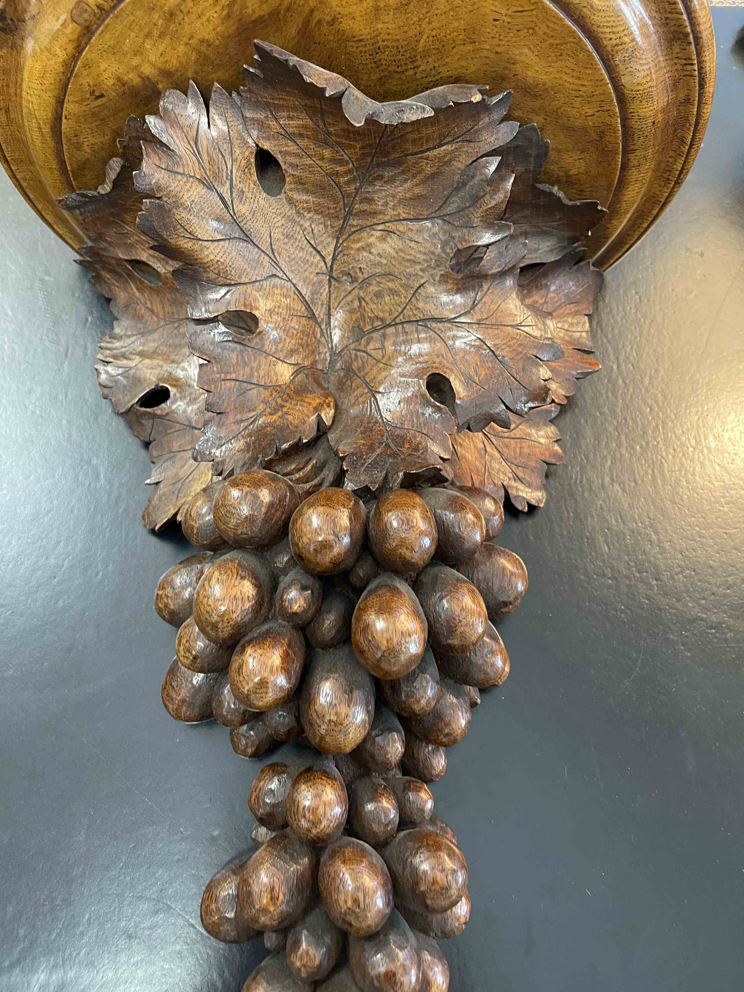 Pair of carved walnut brackets