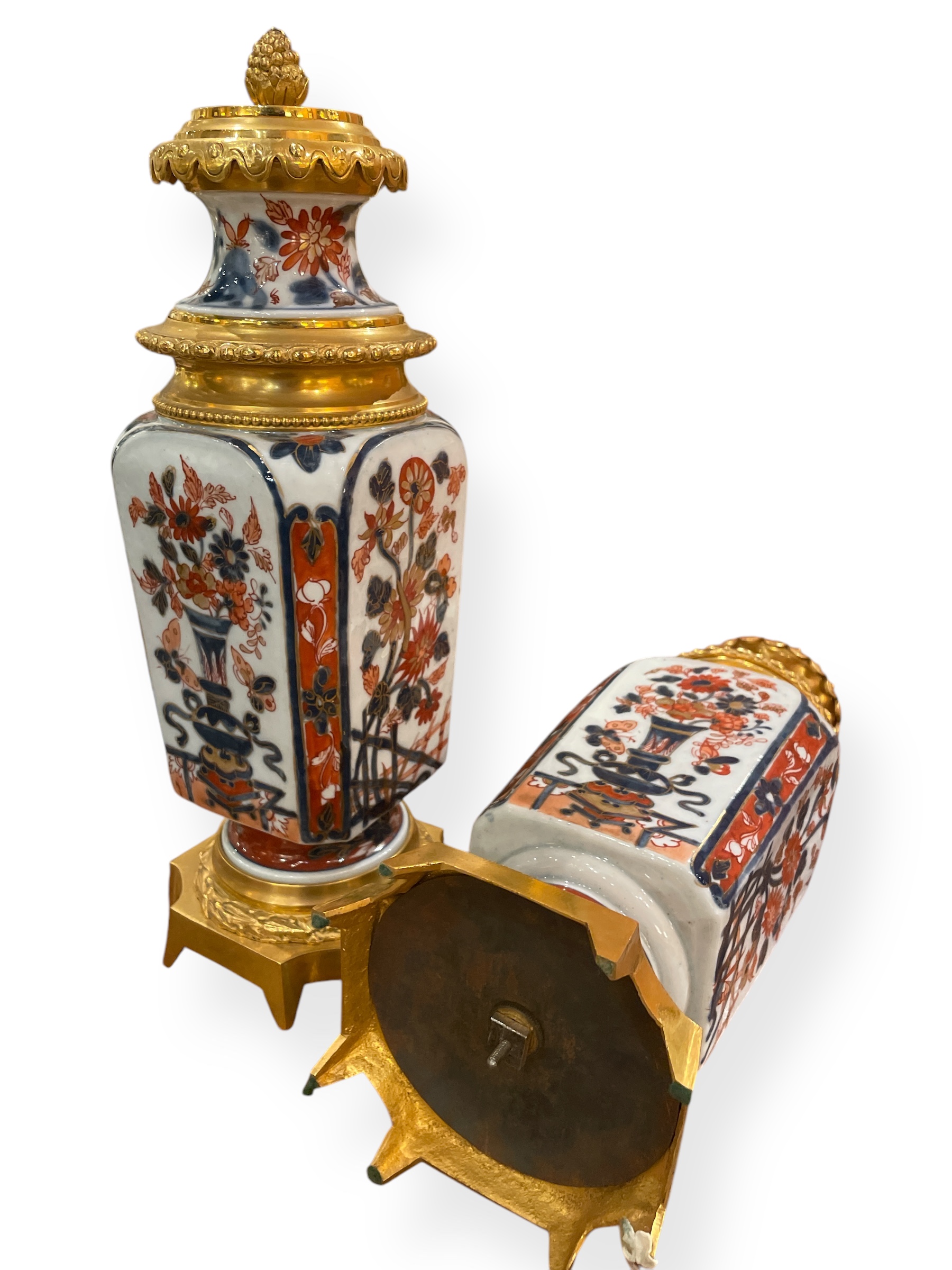 Pair of Imari porcelain urns w/ pineapple finials