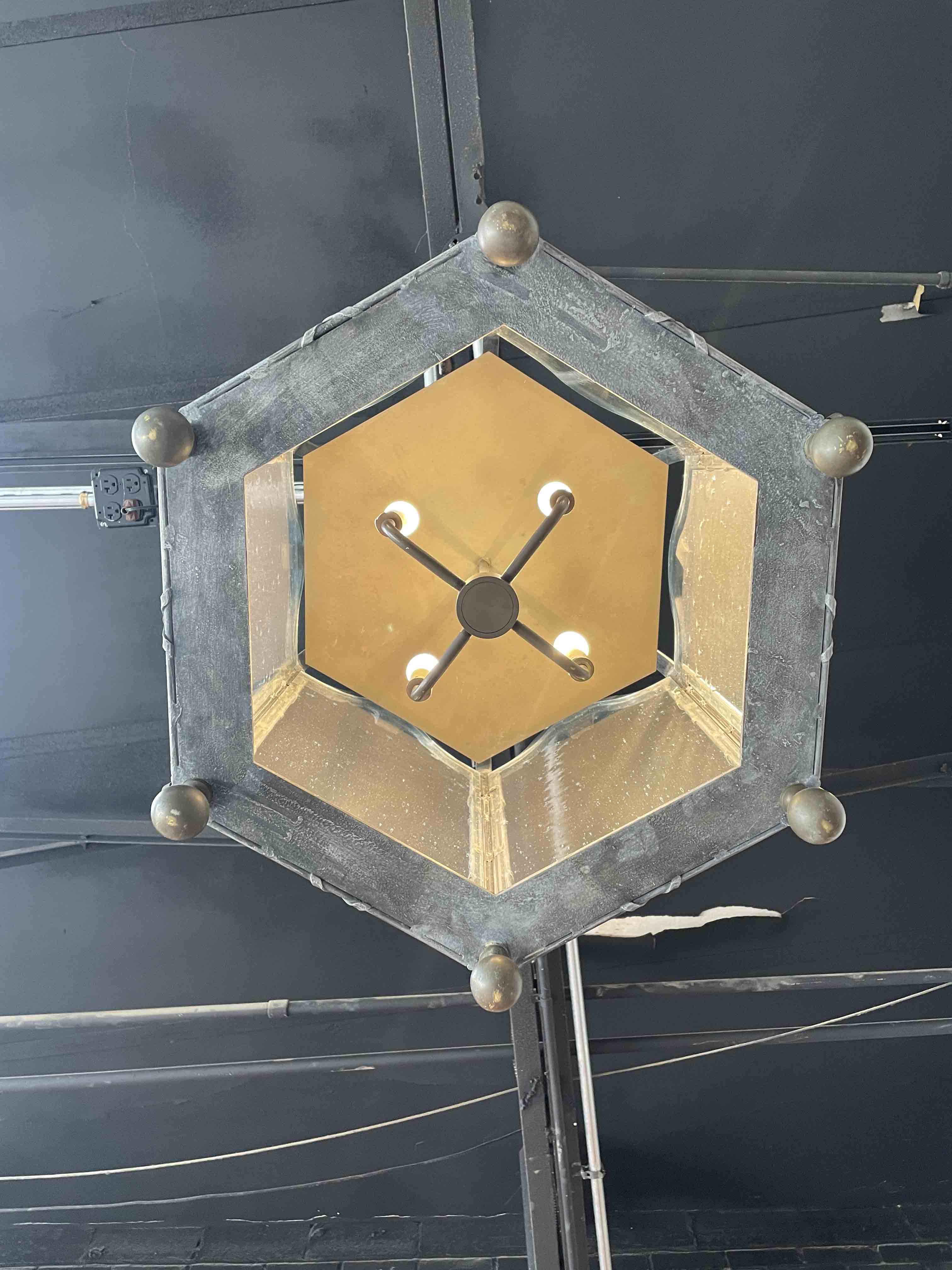 American patinaed metal hanging lantern with seeded glass 