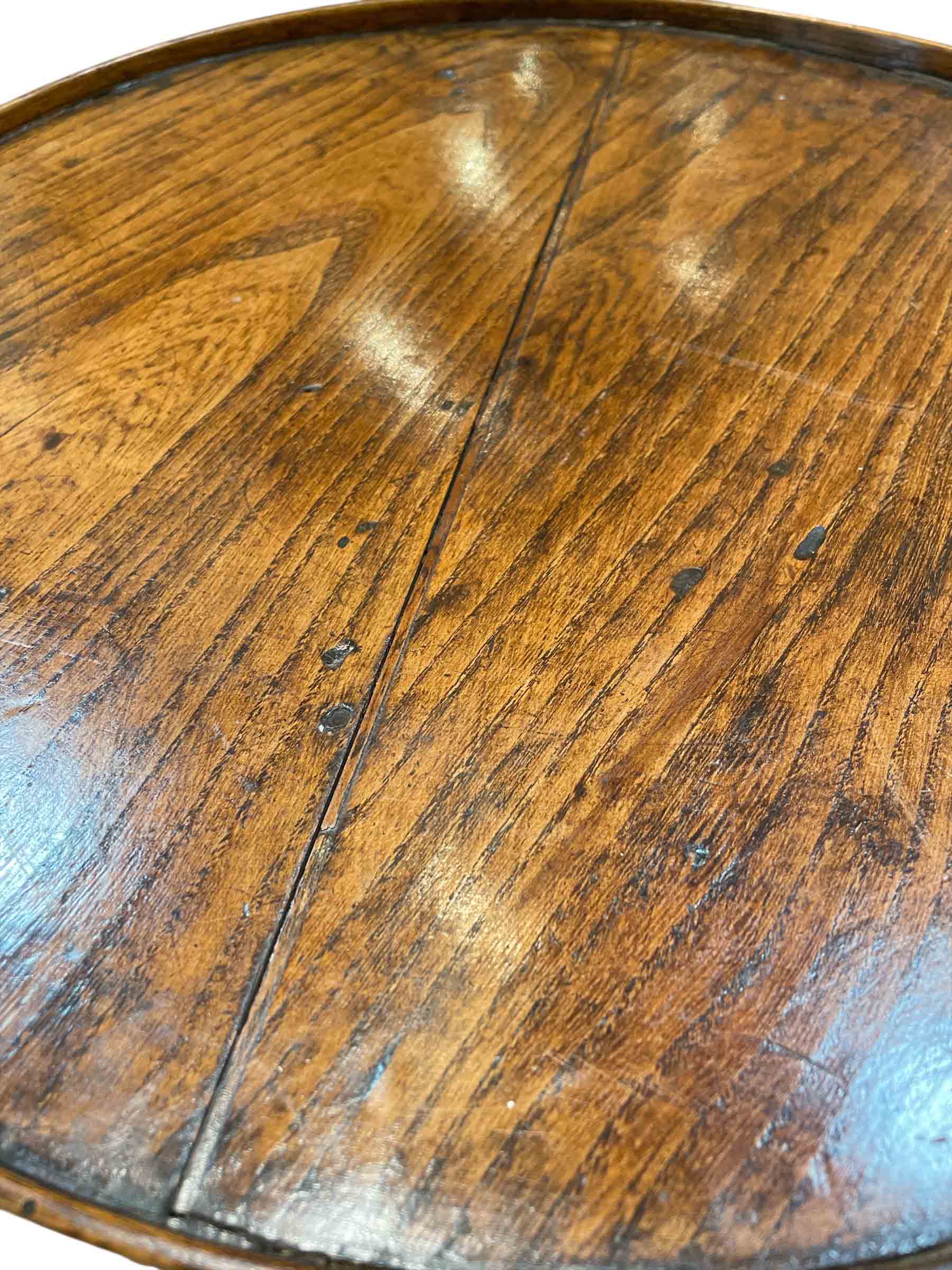 Small French walnut round table with single drawer