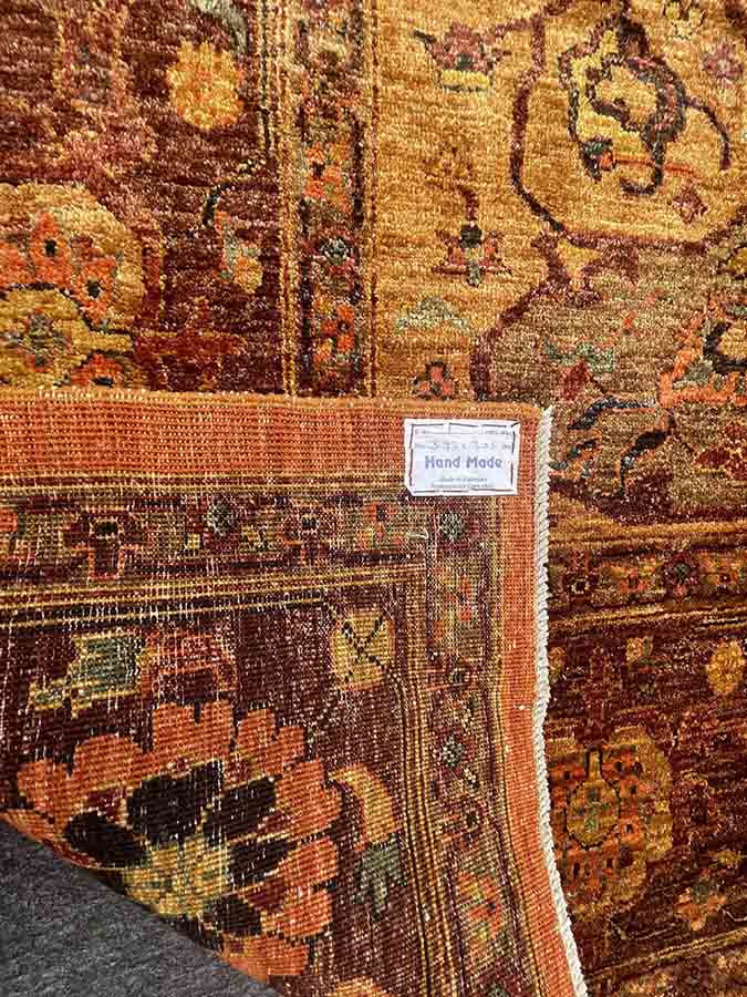 Hand woven wool Pakistan rug in orange