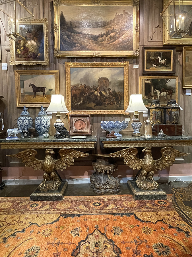 Pair of carved giltwood eagle console tables