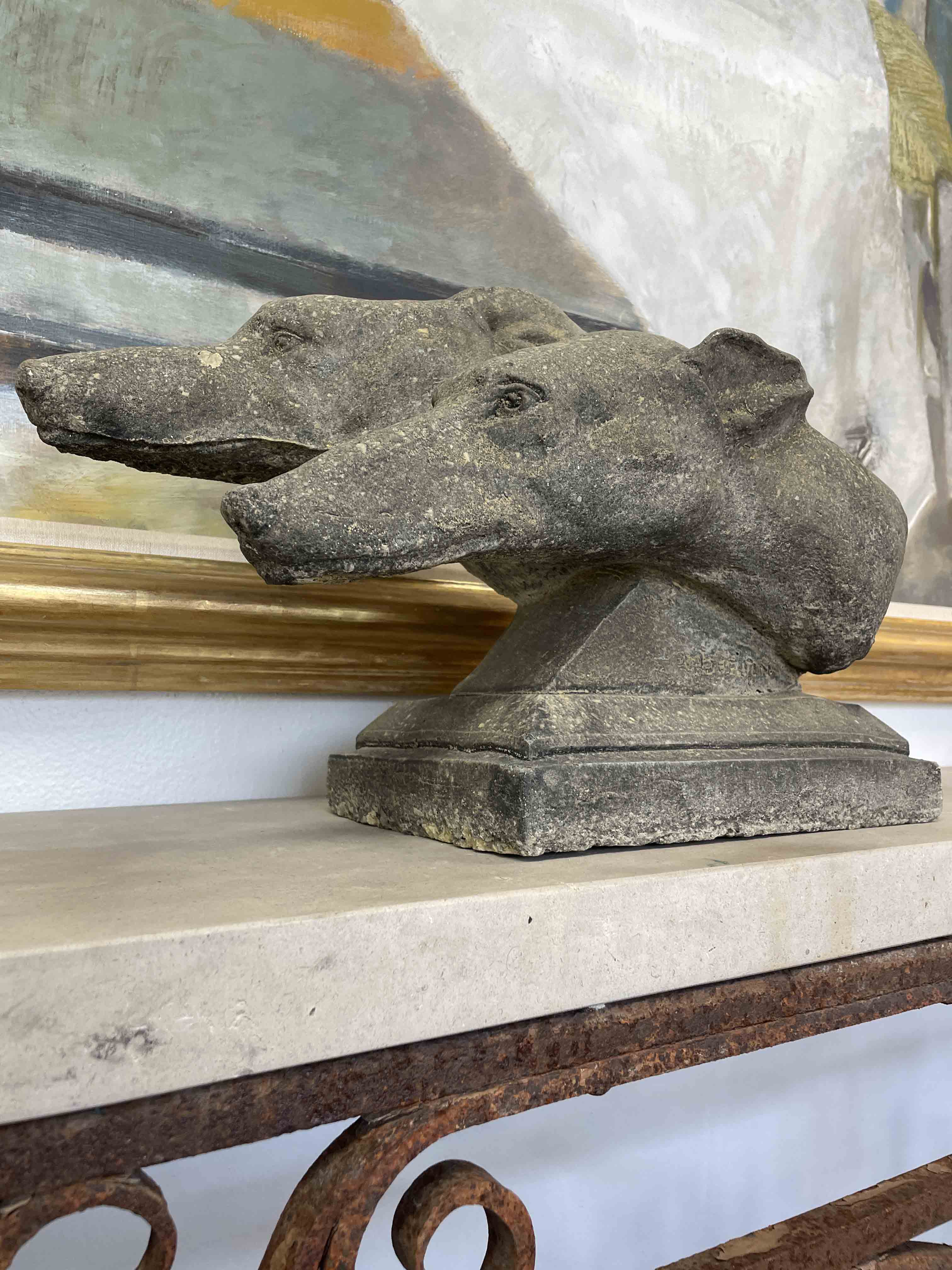 French stone carving of two grey hounds
